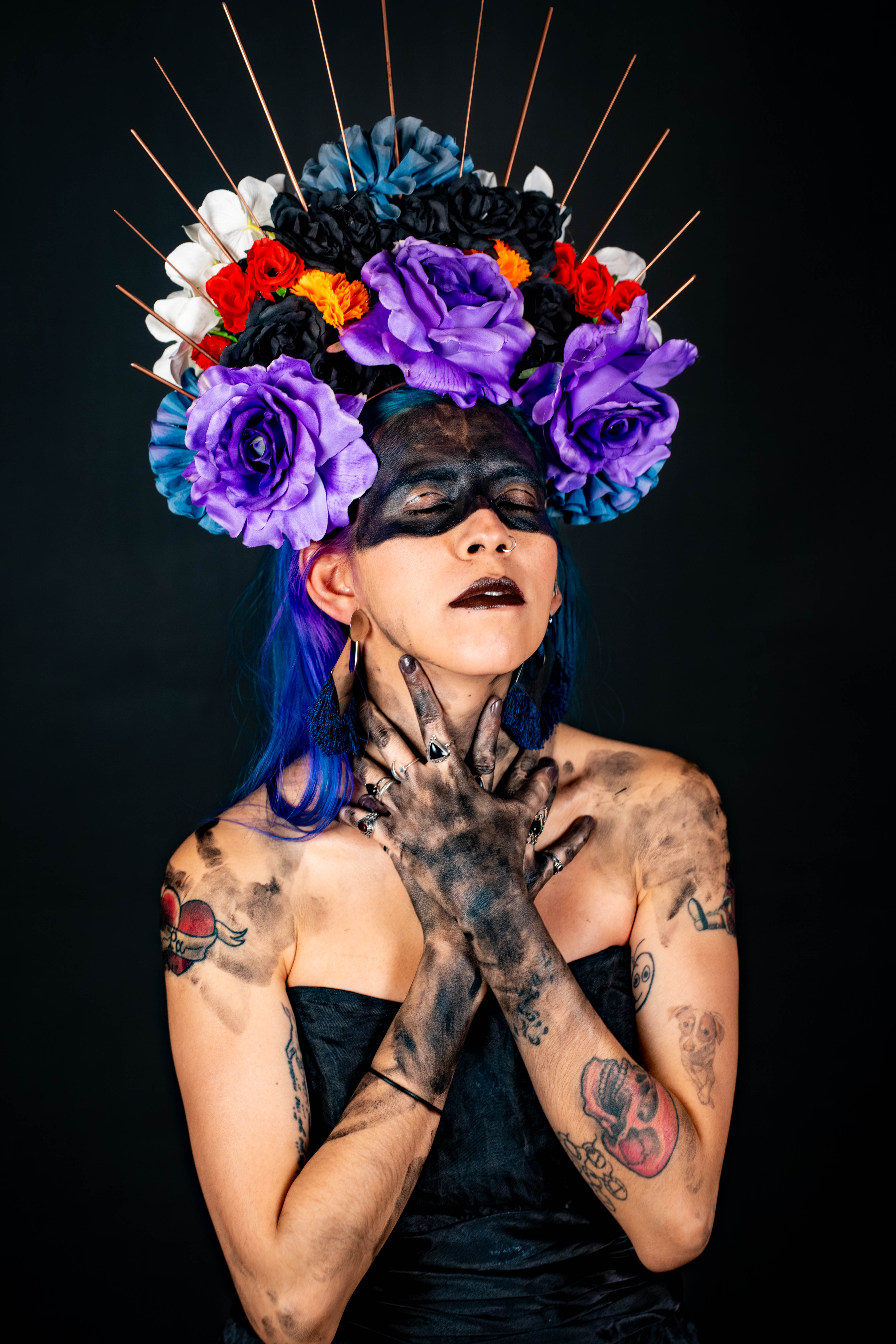 Dark goddess with flower crown and black paint — fantasy editorial at Starfall Studios
